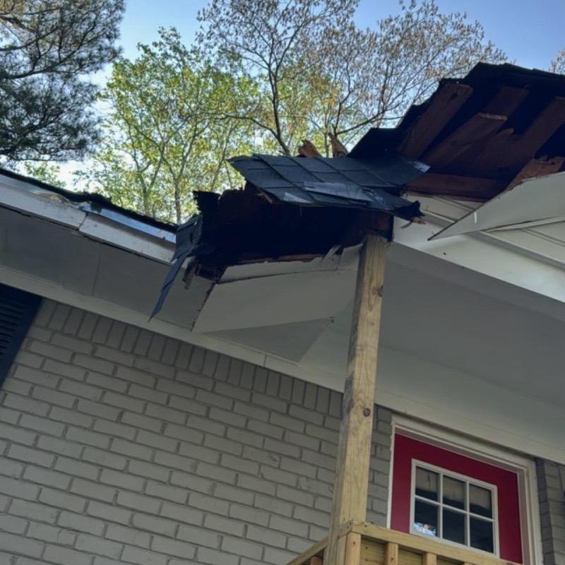 Roof decking and shingles damaged on front porch roof