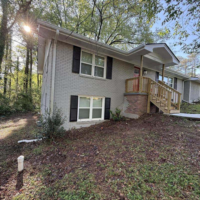 Ridge vent and gutters replaced on brick house exterior