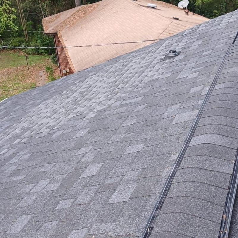 Asphalt shingle roofing with ridge vent installation