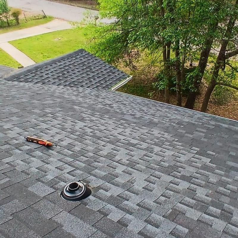 Asphalt shingle roof with new ridge vent and gutters