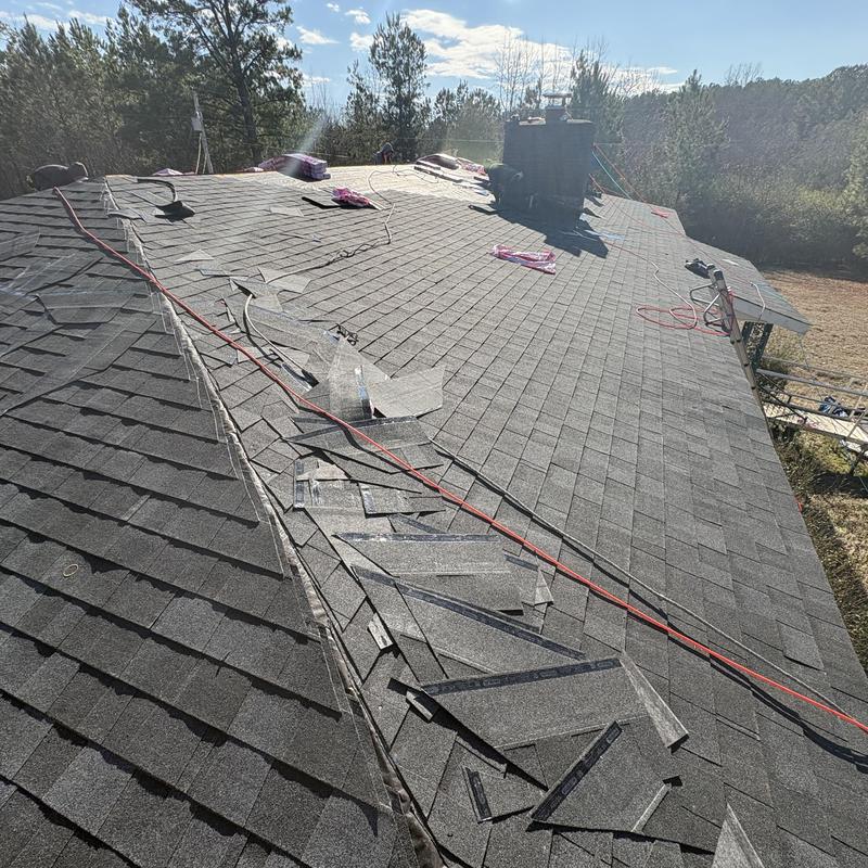 Asphalt shingle roof installation with materials and tools