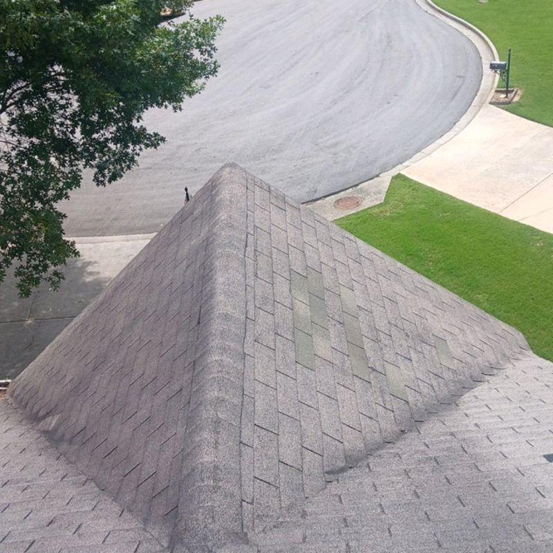 Damaged shingles on roof replaced and sealed ridge cap