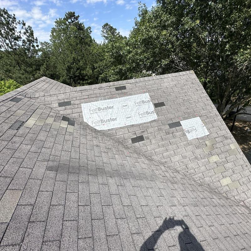 Roof shingles with FeltBuster patching on residential roof