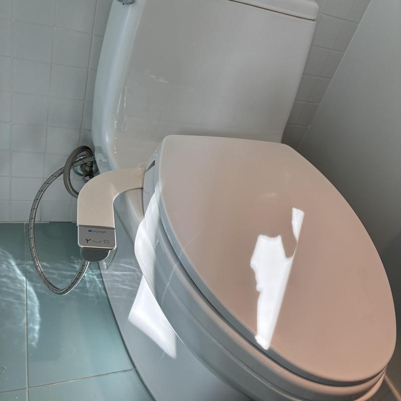 Bidet attachment installation on residential toilet
