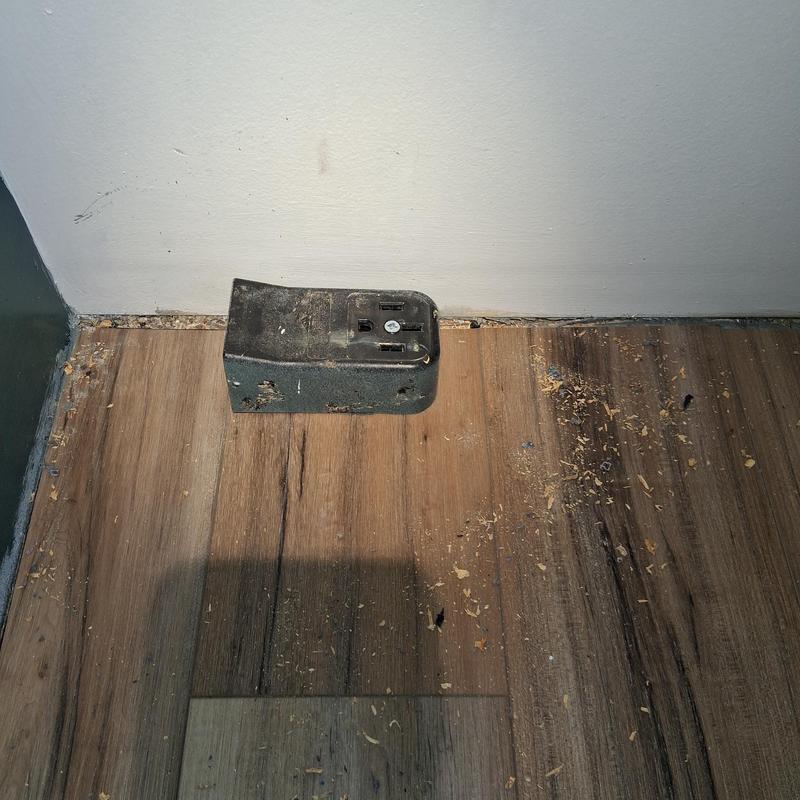 GFCI and duplex receptacle on wood floor baseboard GFCI and duplex receptacle on wood floor baseboard