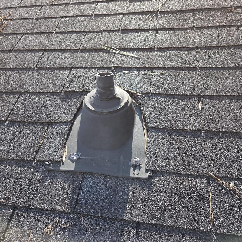 Roof vent flashing with surrounding shingle repair