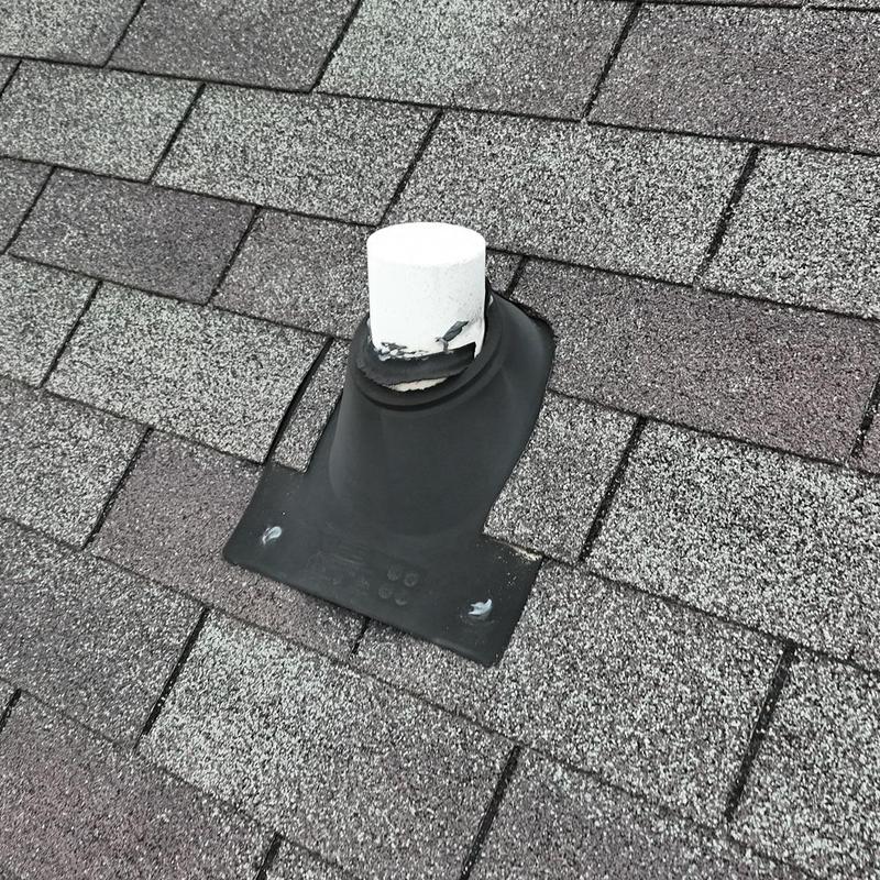 Pipe boot on asphalt shingle roof with new caulking