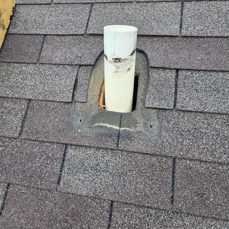 Pipe boot with missing shingles on roof surface