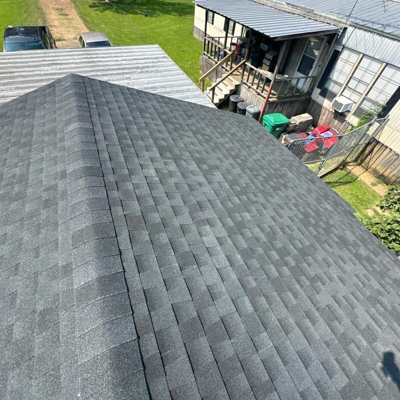 Asphalt shingle roof installation on residential building Asphalt shingle roof installation on residential building