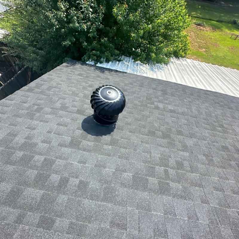 Roof turbine vent on asphalt shingle roof installation Roof turbine vent on asphalt shingle roof installation