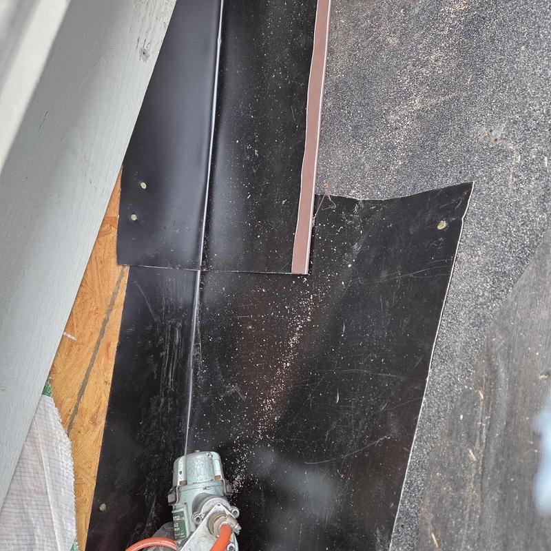 Roof flashing installation with nail gun and plywood base