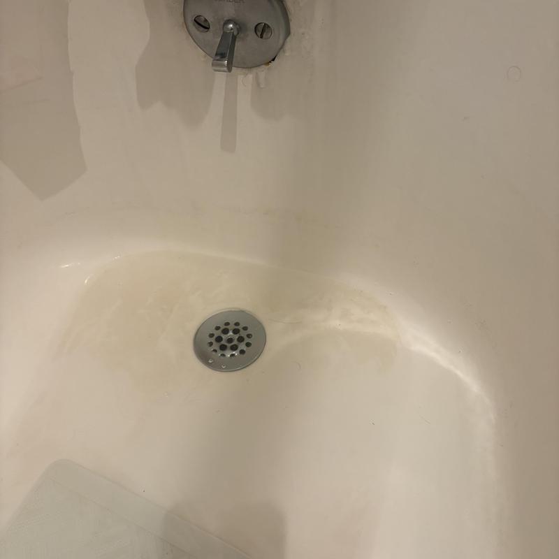 Bathtub drain with metal cover and lever handle