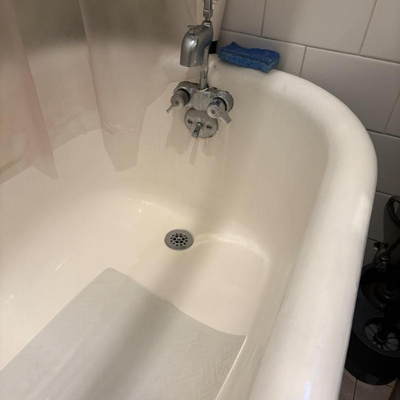 Bathtub drain with faucet and partially removed lever