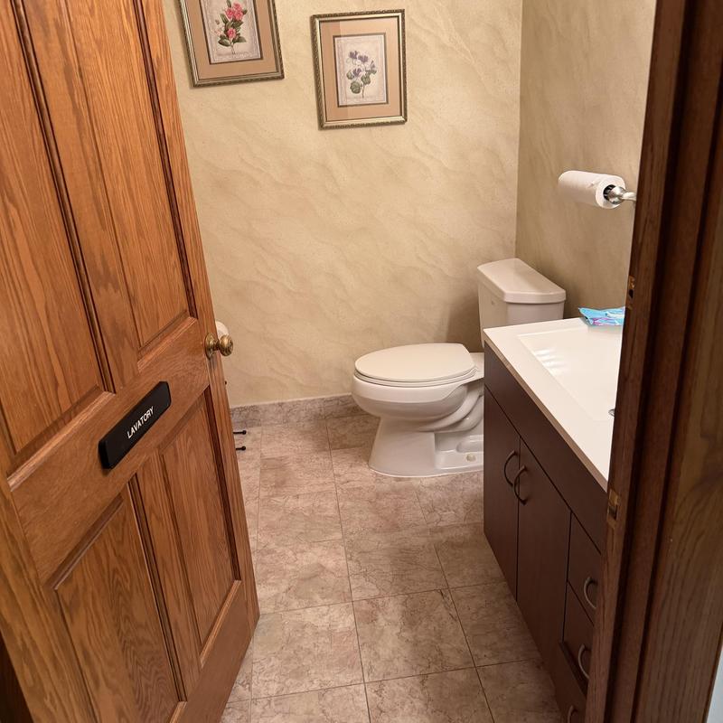 Toilet and vanity in residential bathroom interior