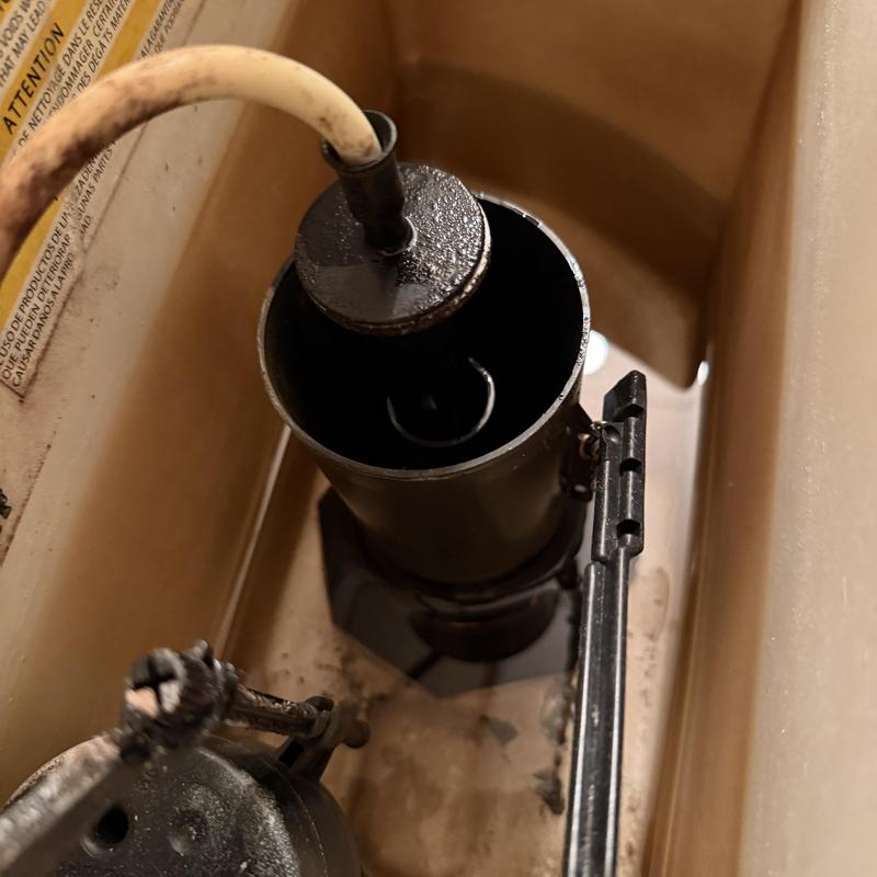 Toilet fill valve and flapper inside tank