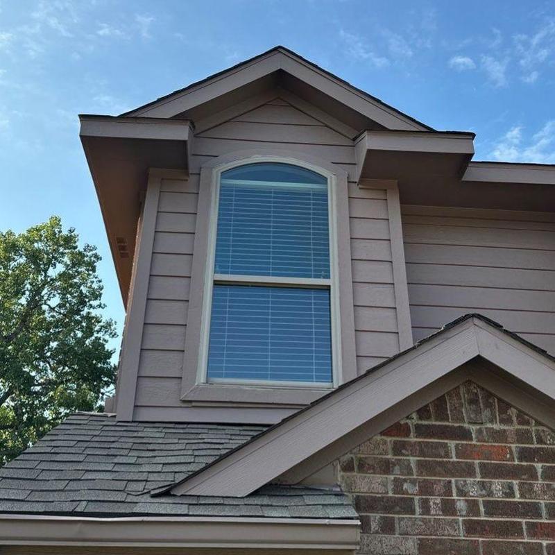 Tan vinyl Burris window with Low-E film installed