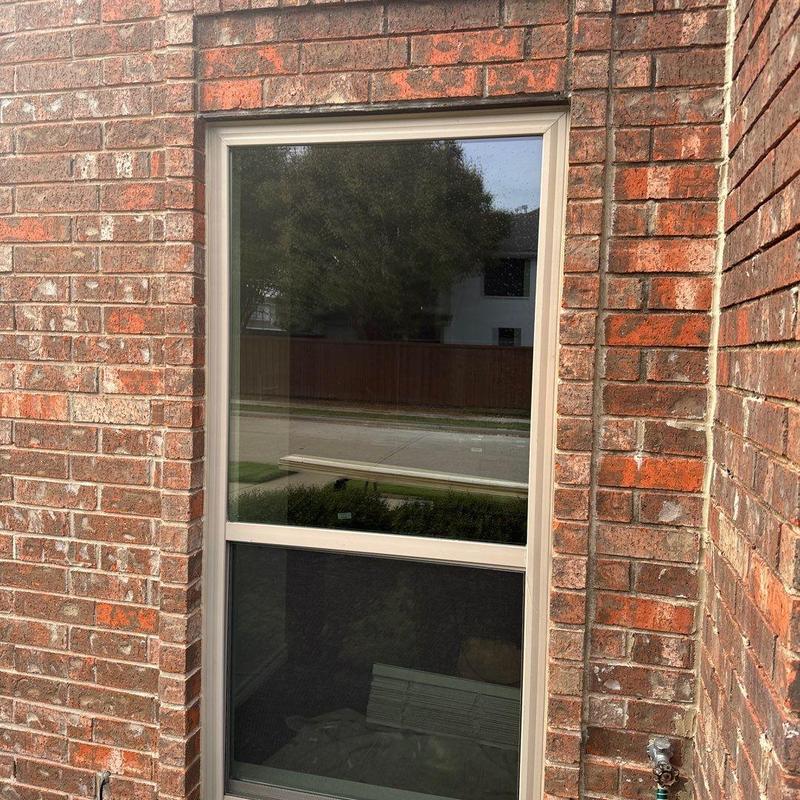 Vinyl Burris window with Low-e film in brick wall