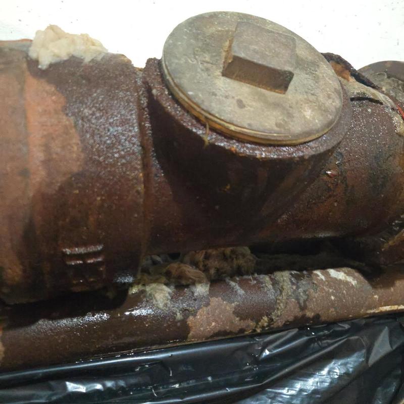 Main water line with rusted pipe and cap