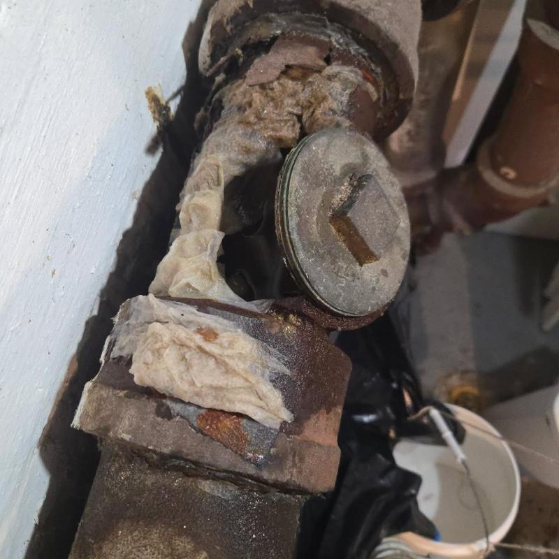 Main water line valve with rust and corrosion damage