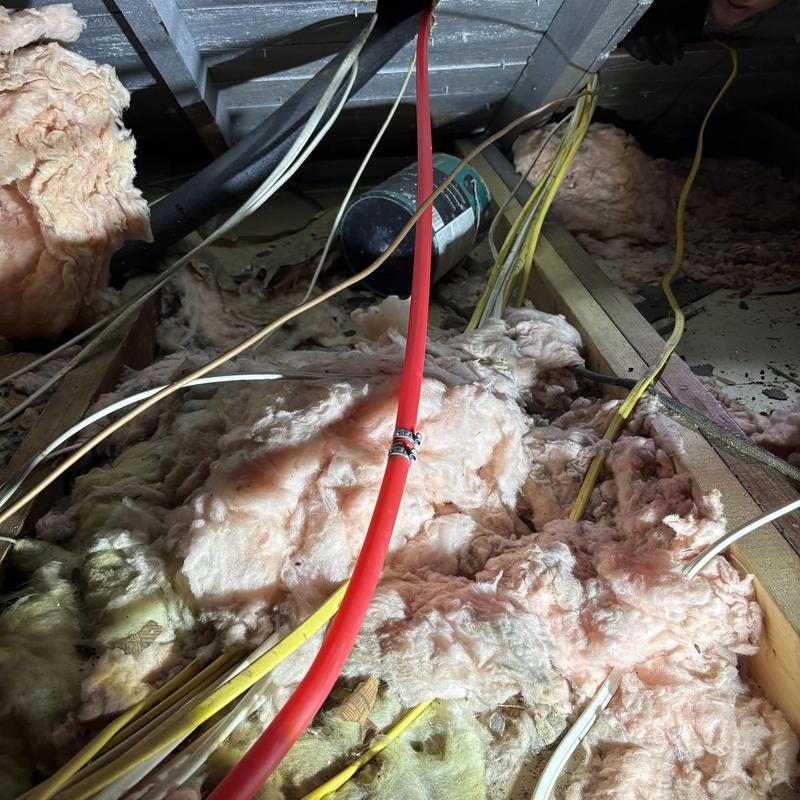 Hotline reroute piping over attic insulation and wiring Hotline reroute piping over attic insulation and wiring