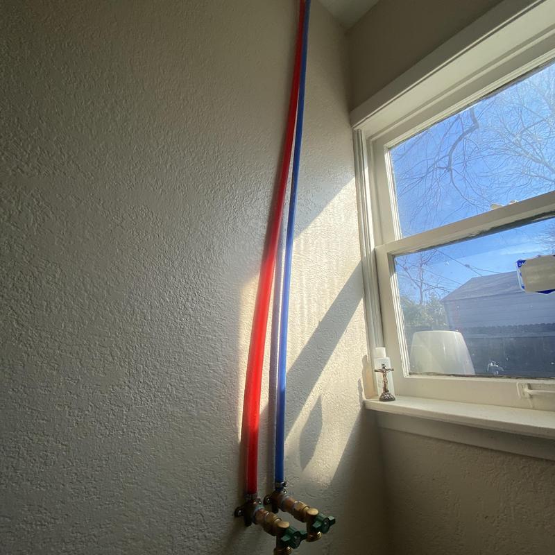 Washing machine water supply line reroute by window Washing machine water supply line reroute by window