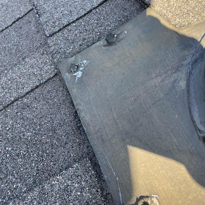 Roof flashing with damaged sealant and exposed nails