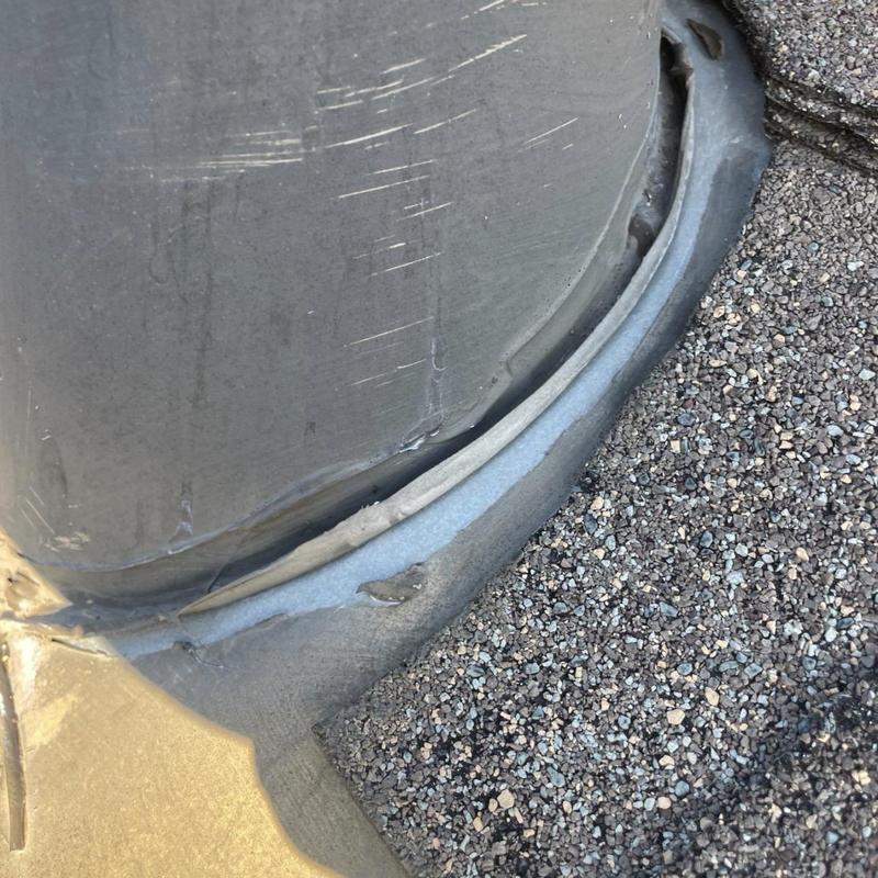 Pipe boot flashing with deteriorated seal on roof