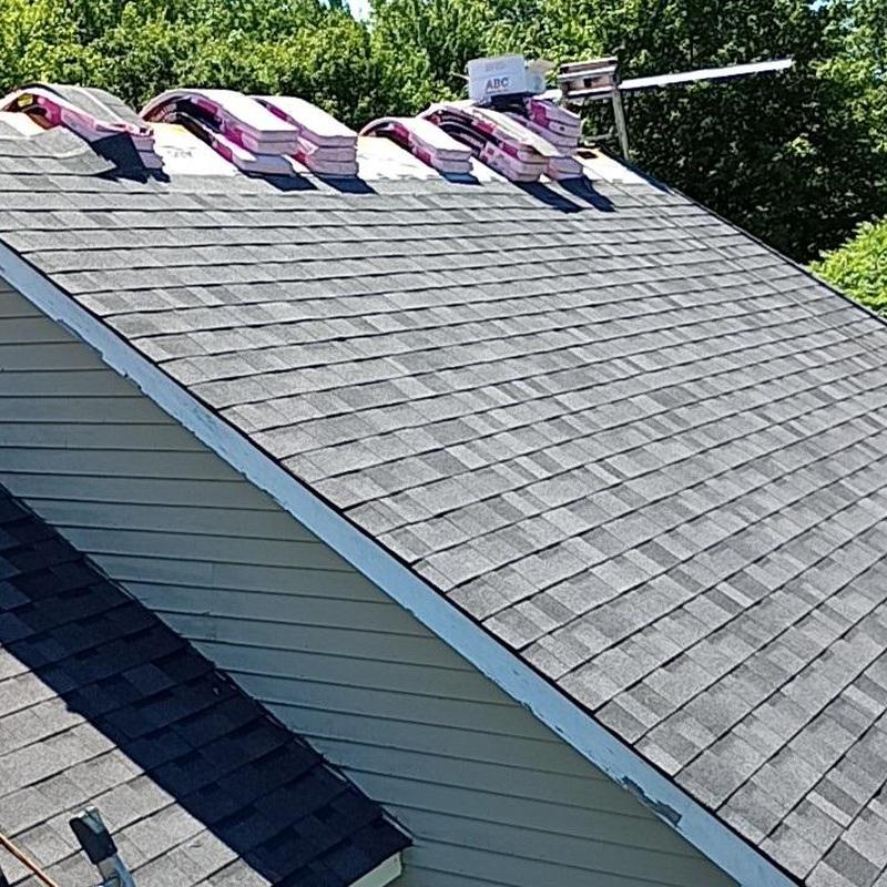 Asphalt shingle roof with bundled shingles on top