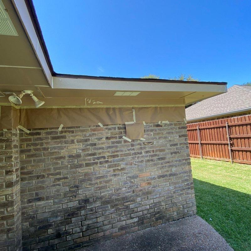 Soffit intake vents and painted brick exterior