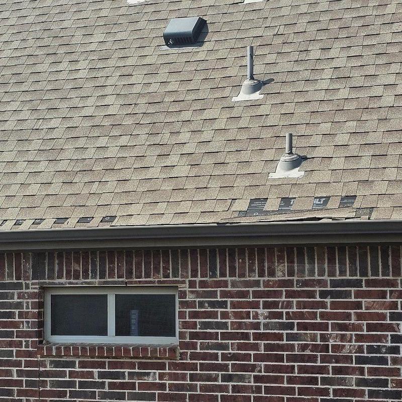 Asphalt shingles with wind damage and nail sealing