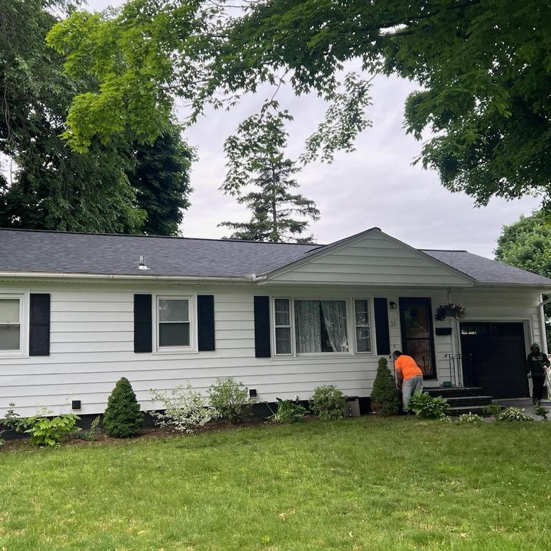 Asphalt shingle roof on white house in South Burlington