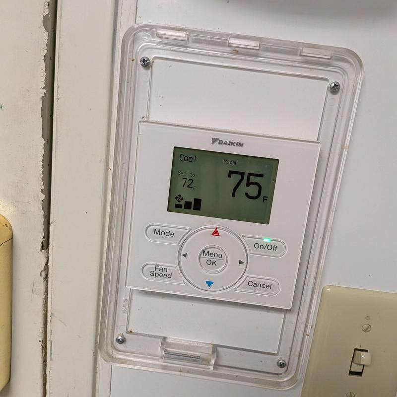 Daikin VRV thermostat control panel in clear case Daikin VRV thermostat control panel in clear case