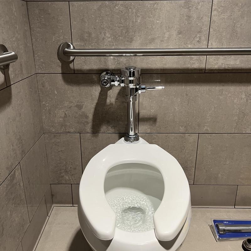 Toilet flush valve with new vacuum breaker installed