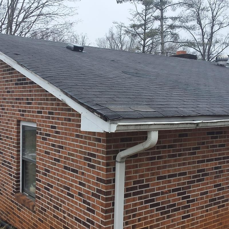 Asphalt shingle roof and gutter system inspection on brick home