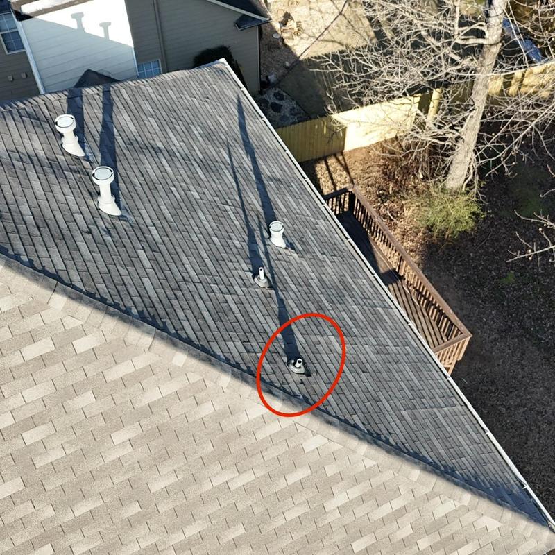 Pipe boot on roof with incorrect size circled in red