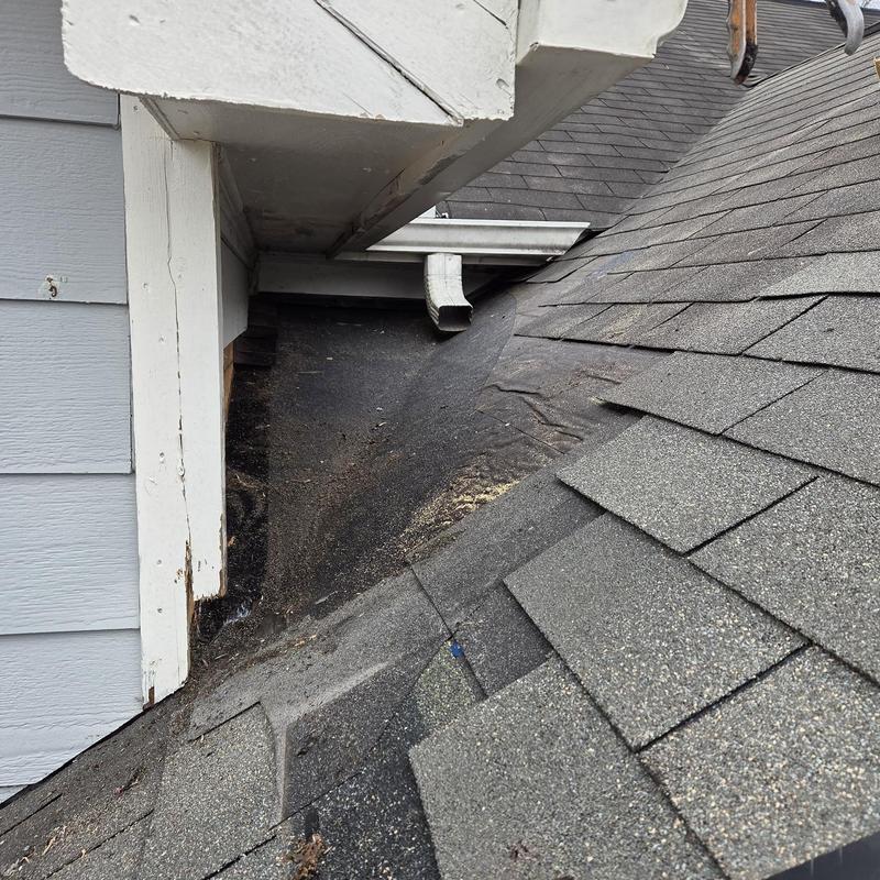 Dead valley flashing with worn shingles on roof