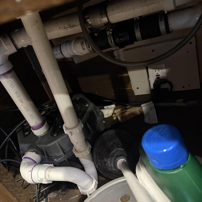 Sink drain pipes with clog removal tool and cleaning bottle