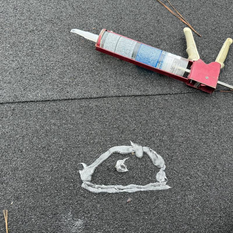 Roofing nail pop hot patch with roofing sealant gun