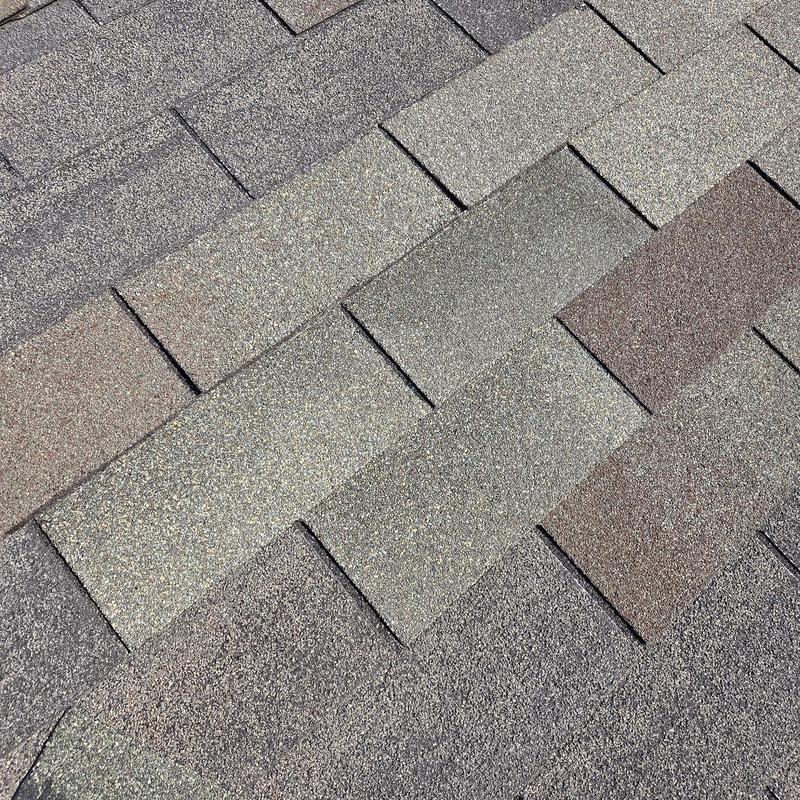 Architectural asphalt shingles with caulked seams