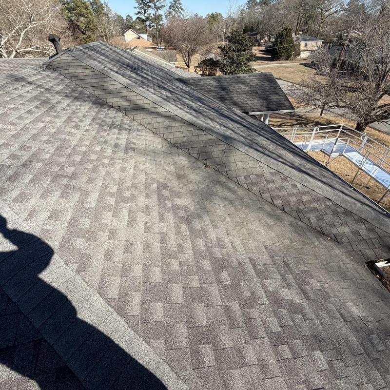 Asphalt shingle roof with ridge vent on house