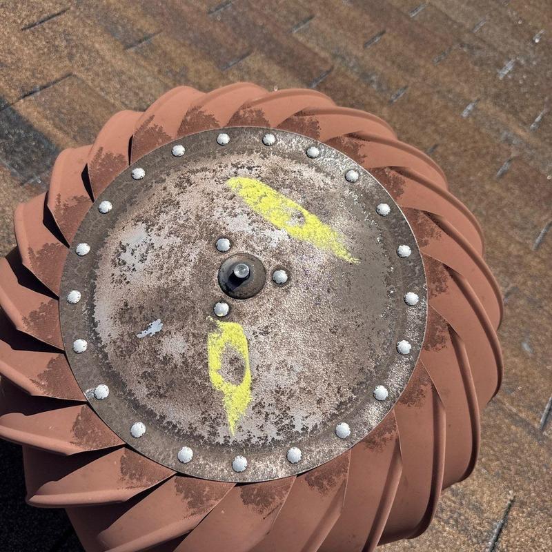 Roof turbine vent with corrosion and markings