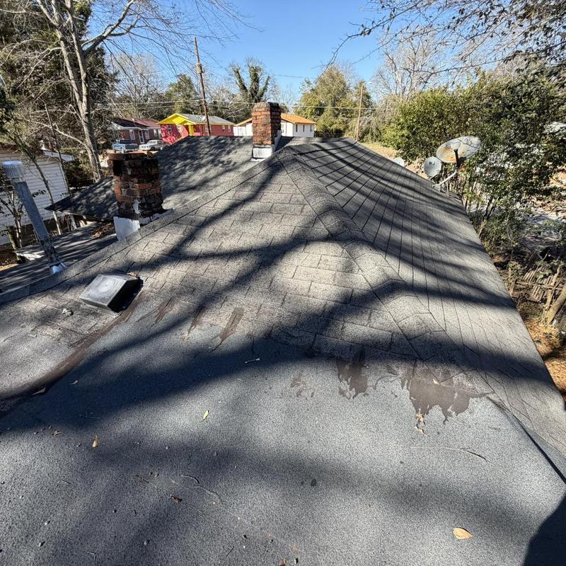 Asphalt shingle roof showing wear and damage for replacement