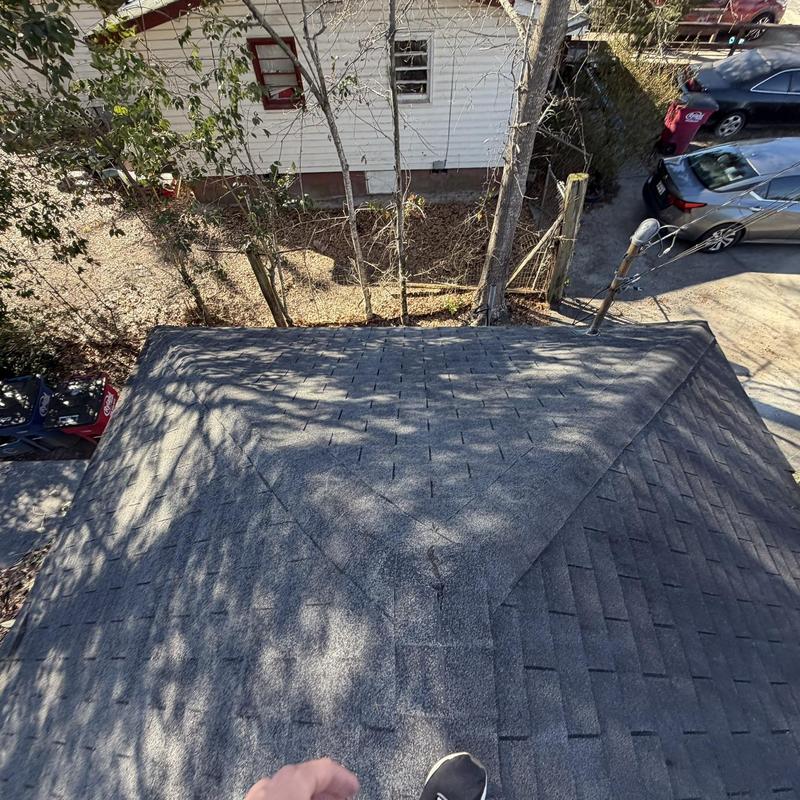 Asphalt shingle roof inspection showing wear and damage