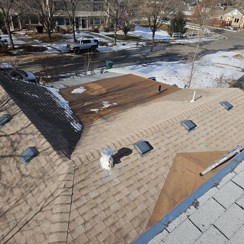 Asphalt shingle roof with hail damage inspection in winter Asphalt shingle roof with hail damage inspection in winter
