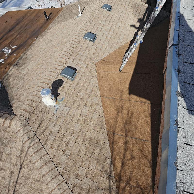 Roof shingles with hail damage and ladder shadow Roof shingles with hail damage and ladder shadow