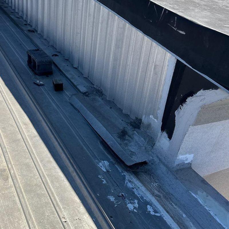 Metal roof flashing with hail damage and wear