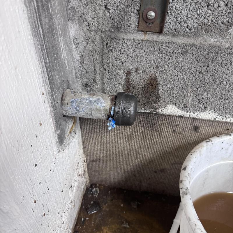 Baseboard heater pipes capped for plumbing repair