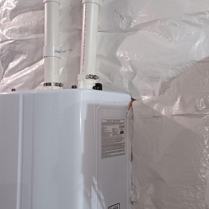 Navian tankless water heater with ventilation pipes