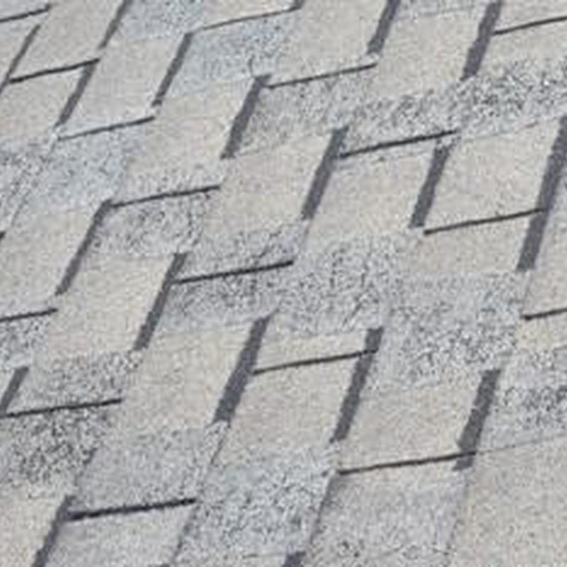 Roof shingles with lifting and wind damage