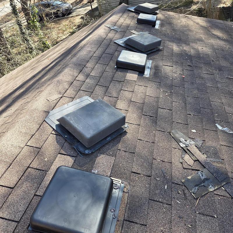 Box vents and pipe boot on asphalt shingle roof